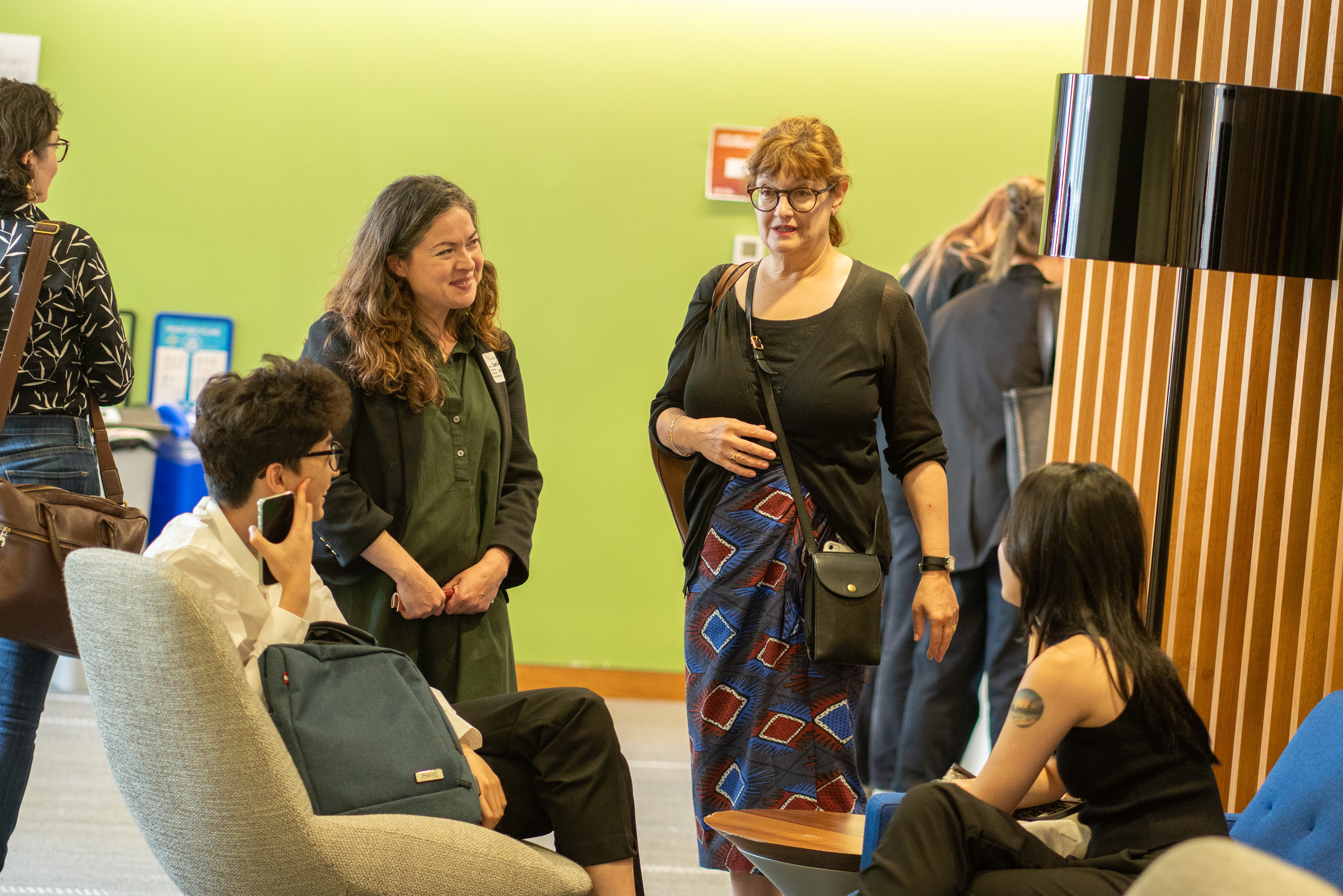 A CUSP capstone sponsor talks with a group of students. 