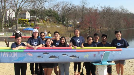 canoe team with boat