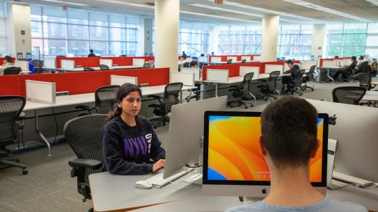 students using desktop computers at the library