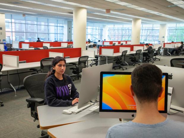 students using desktop computers at the library